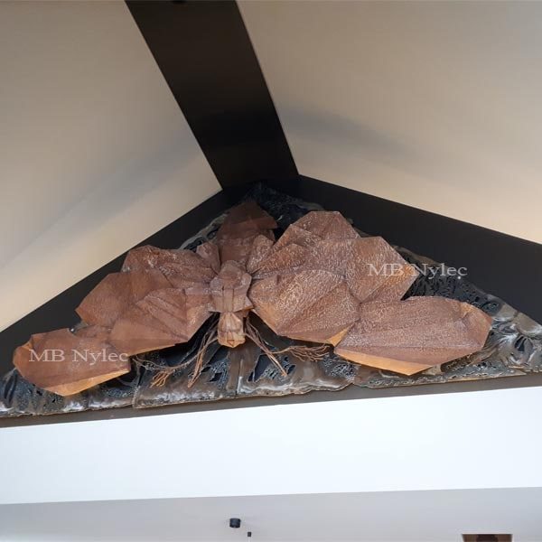 Steel moth bas-relief Z60 mounted high in the gable of an interior