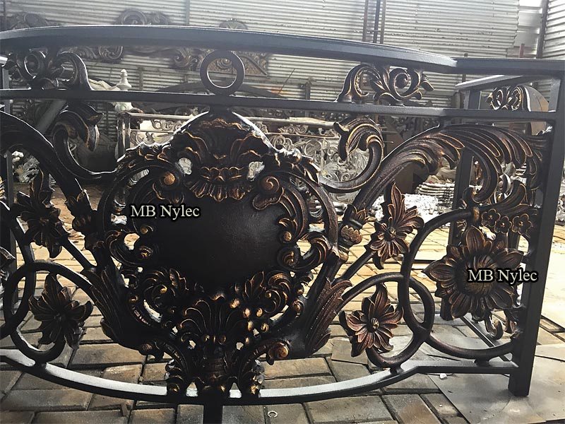 Curved oriental balcony railing BA81 with a medallion, rosettes and scrolls