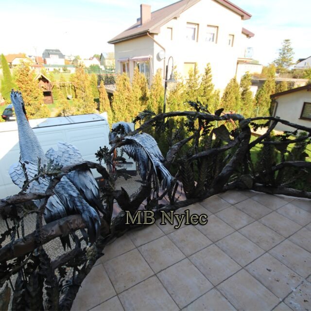 Original design railing with a white steel heron