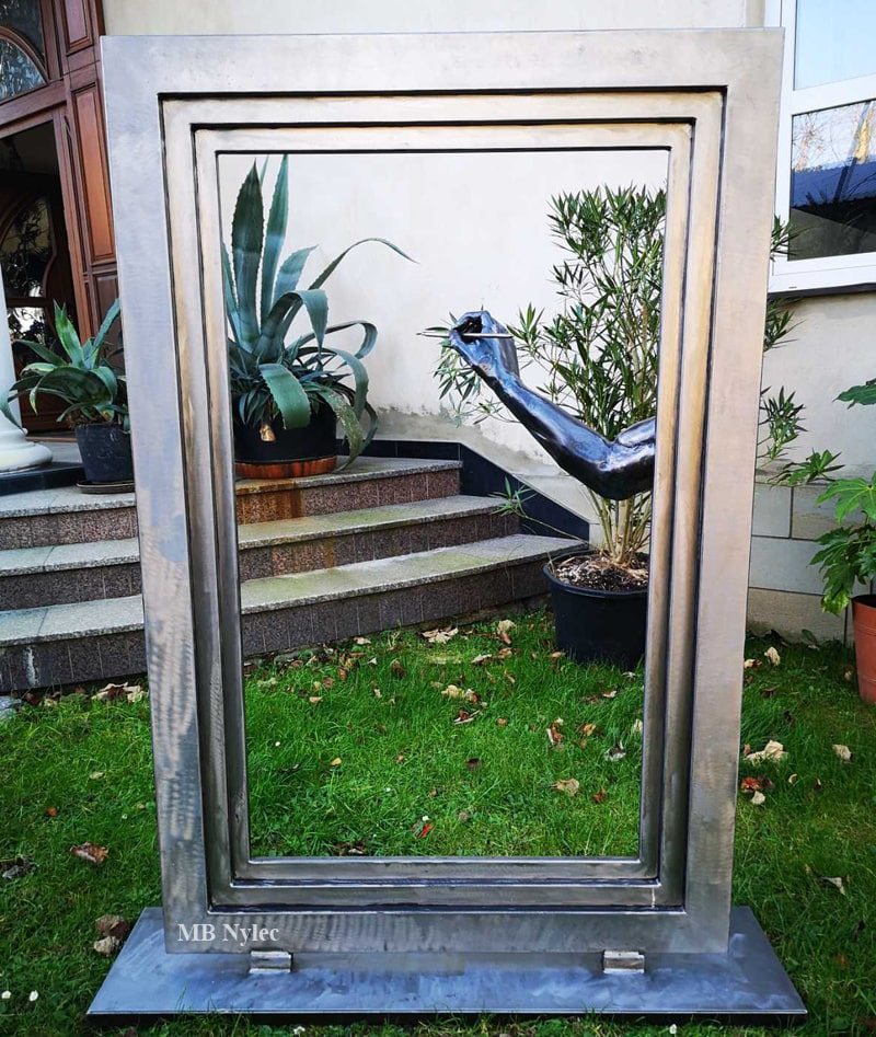 Painter modern metal sculpture in a garden