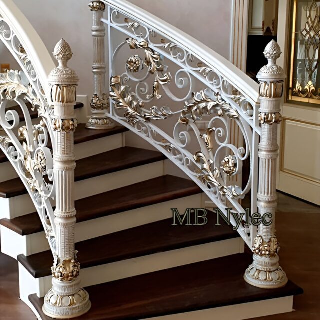 Palace stair railing with gold spirals and rosettes
