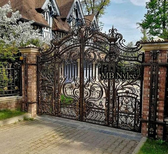 Baroque palace gate BP158 with dense scrolls between brick piers, the partner of wicket BP158F