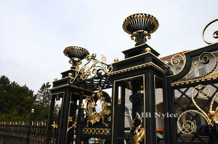 Vase-topped pillars S3 photographed from below with gilded scrolls
