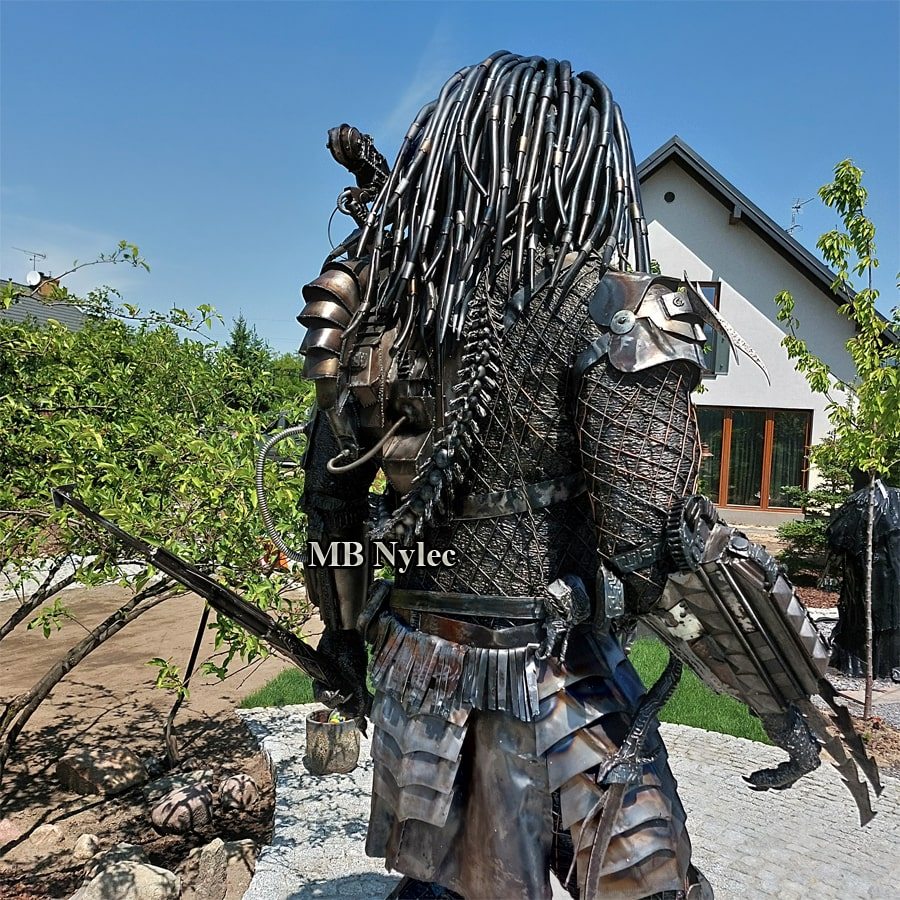 Back of the steel Predator Z104 showing layered armour and dreadlocks