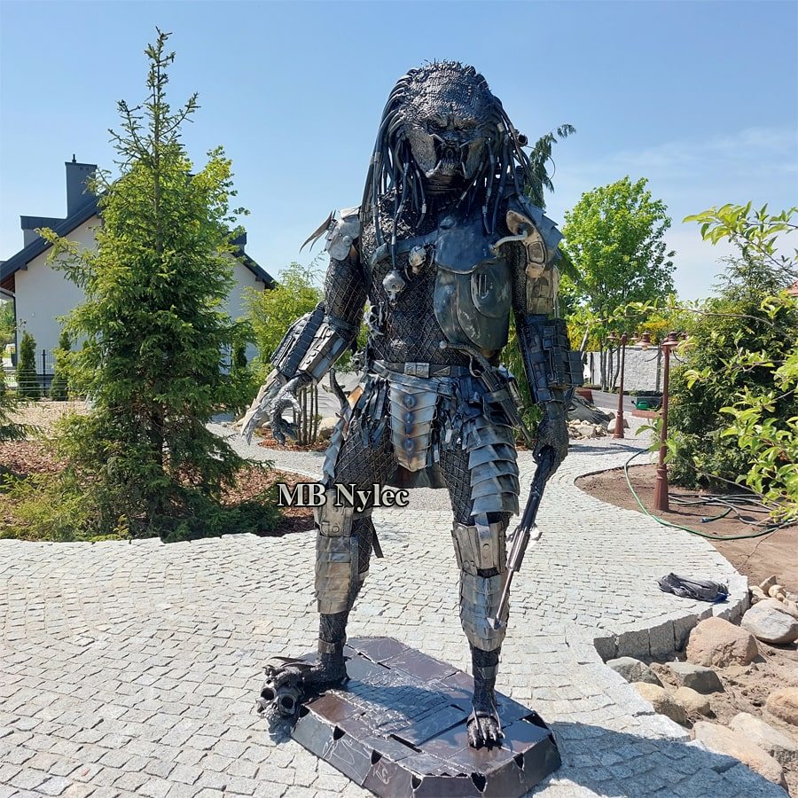 Front view of the steel Predator figure Z104 on a garden path