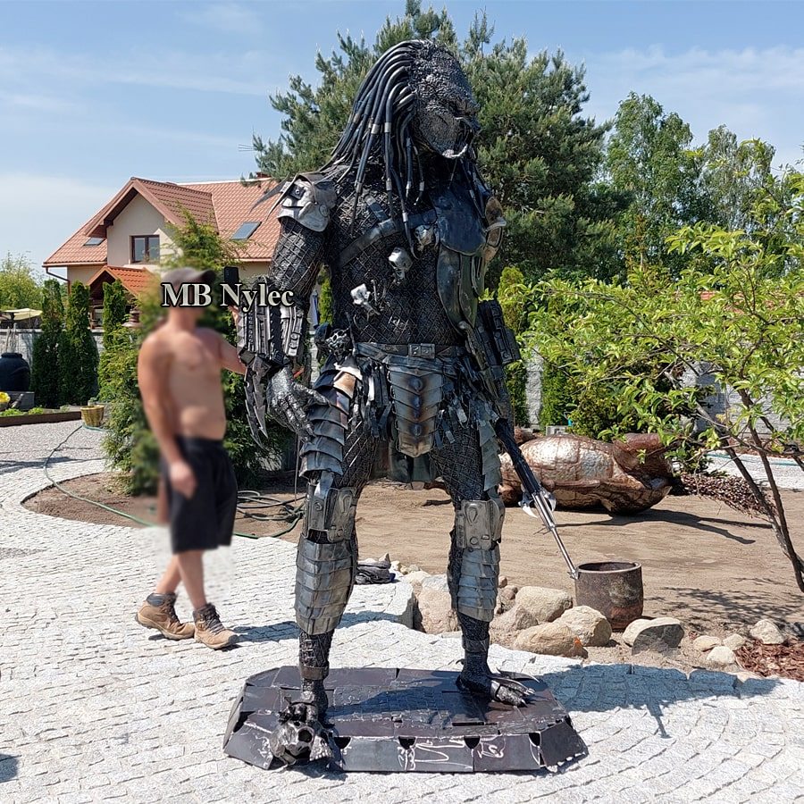 Steel Predator Z104 beside a person, showing its 240 cm height