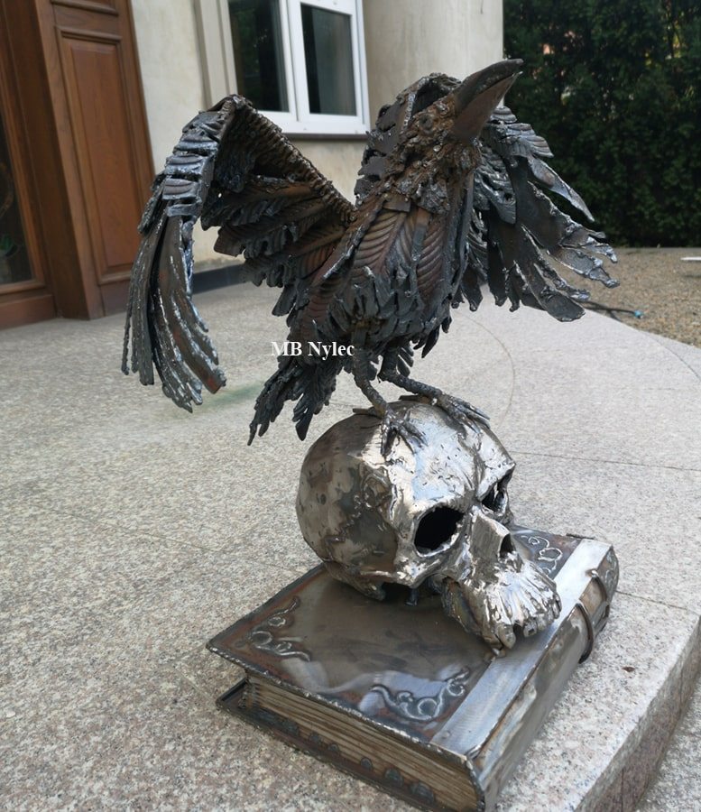 Raven sculpture with a polished steel skull