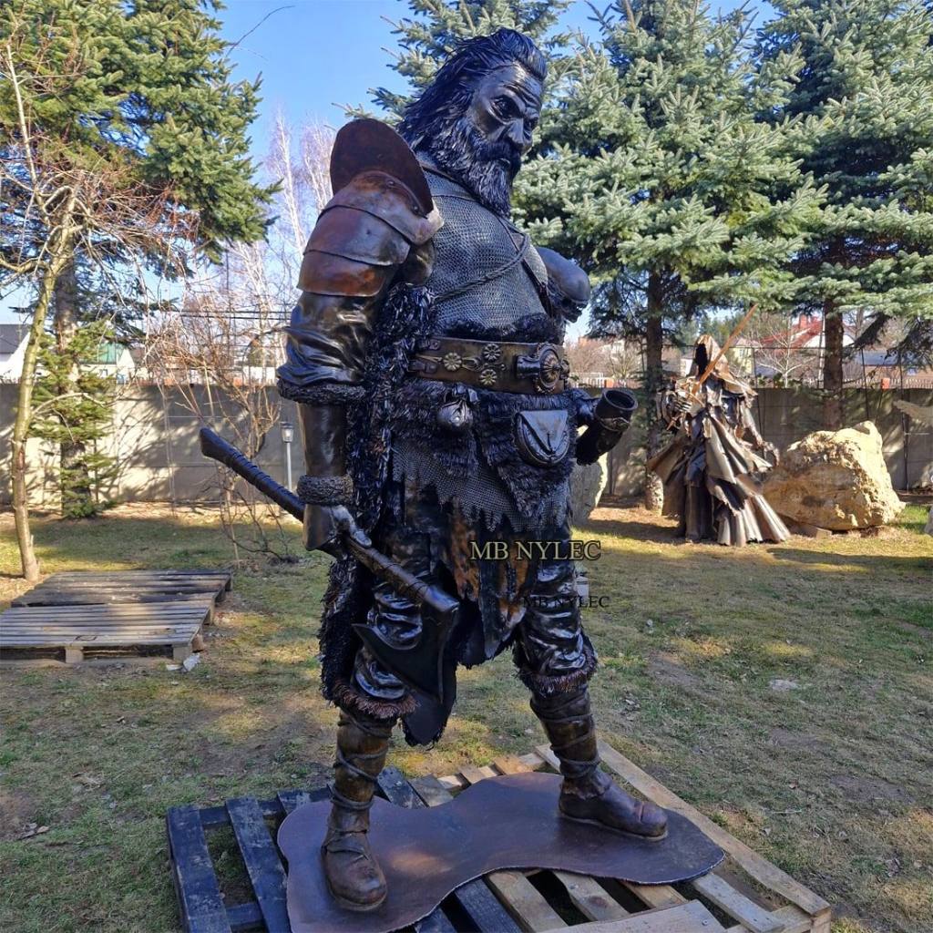 Realistic 240 cm Viking warrior sculpture in steel and brass holding an axe