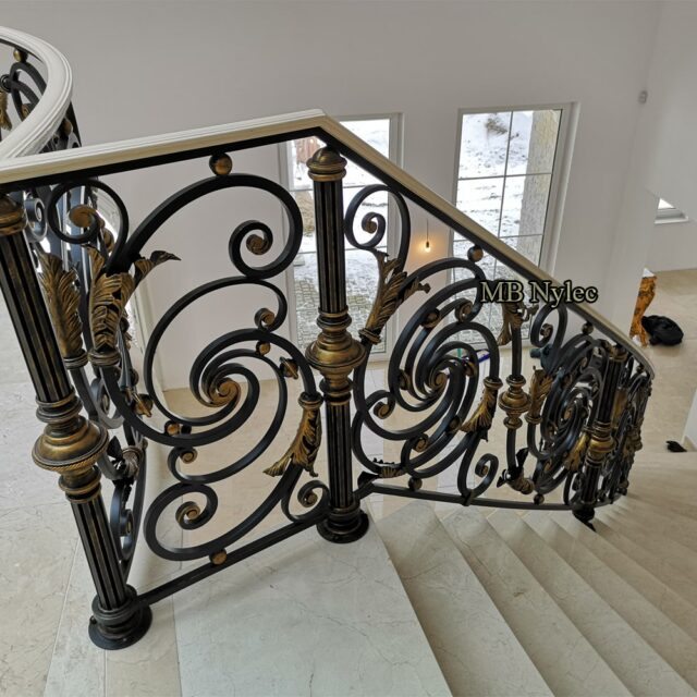 Rococo-style stair railing with gilded details