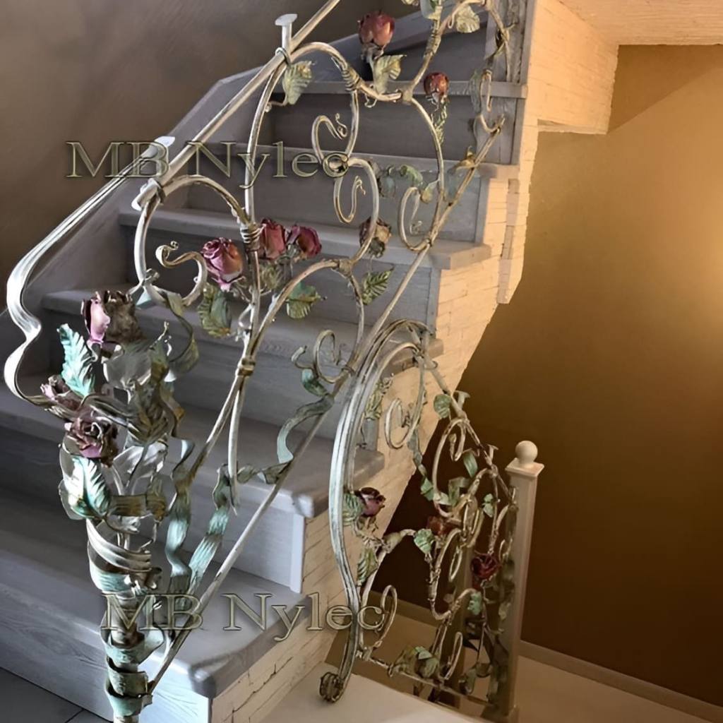 Rose stair railing BA55 with forged roses and leaves in a light patina on a white stair