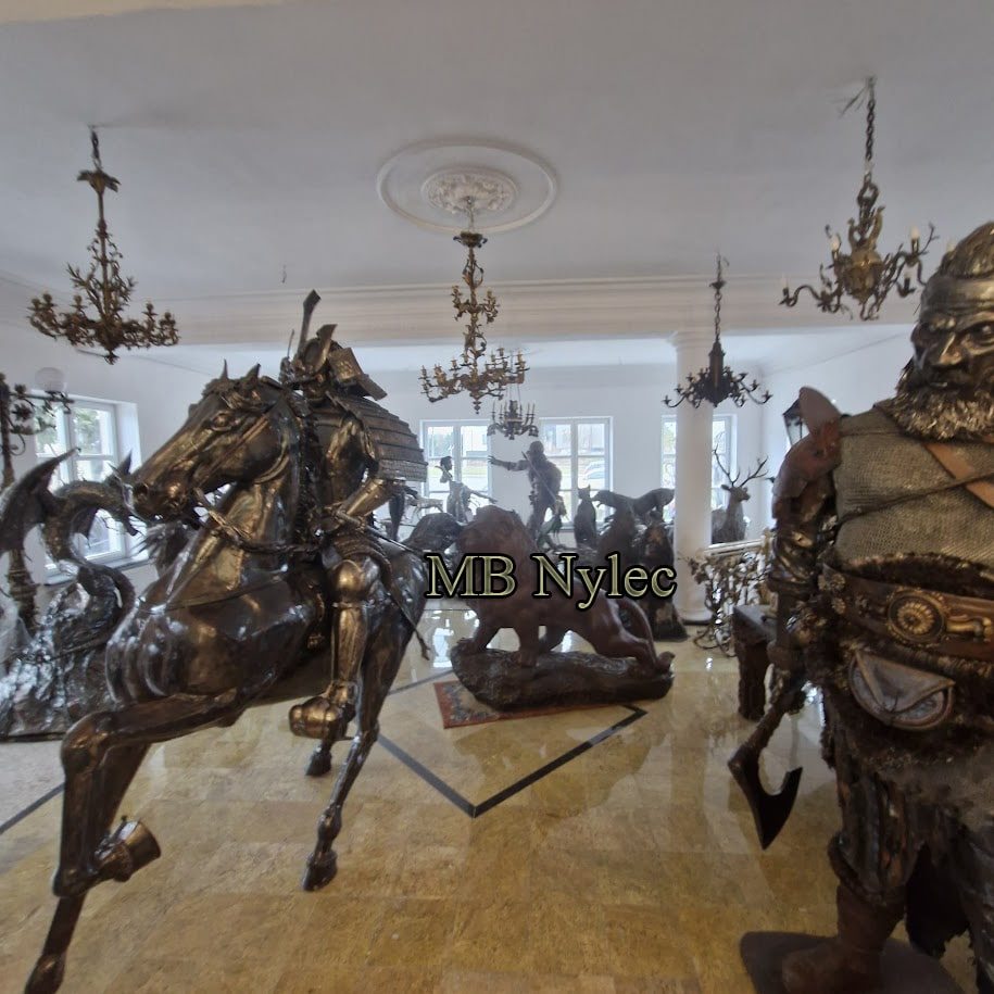 Showroom interior with a steel horse and rider among other metal figures