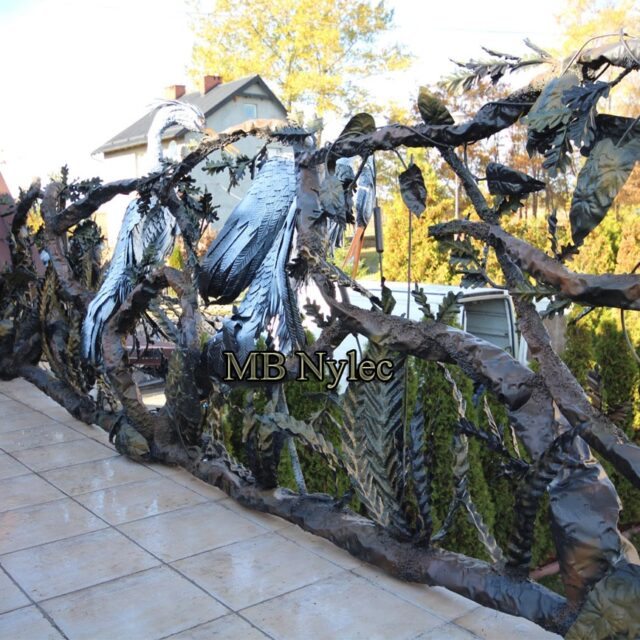 Spatial railing with herons and branches along a terrace edge