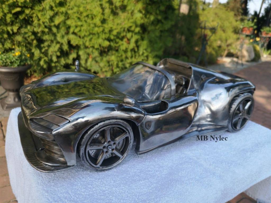 Stainless steel Ferrari model from the front three-quarter view