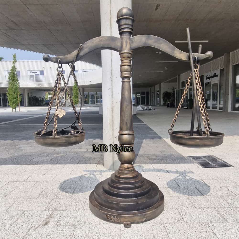 Large steel balance scale sculpture at the Green Market in Ciechanów