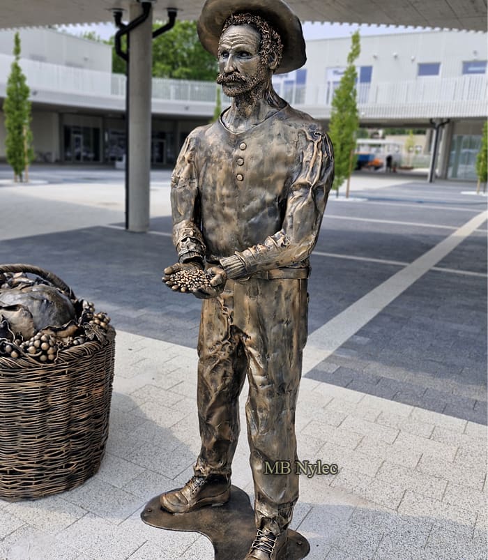 Farmer Holding Grain