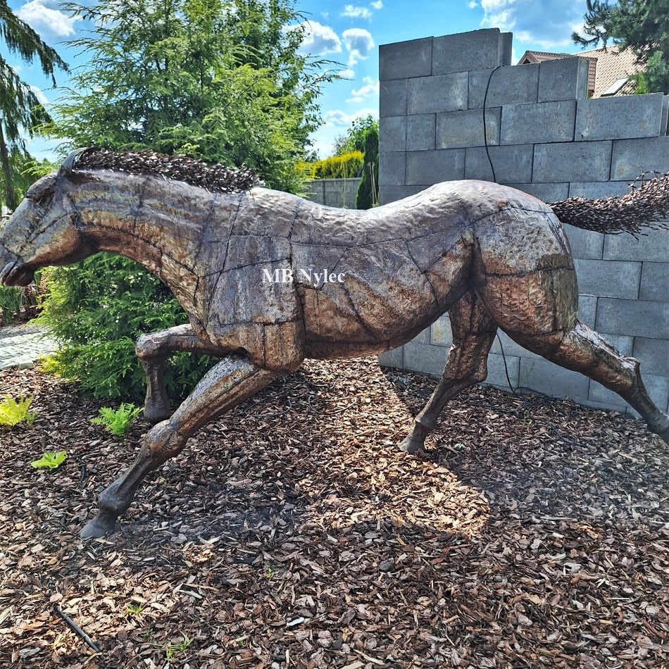 Side view of a steel horse figure made of overlapping plates