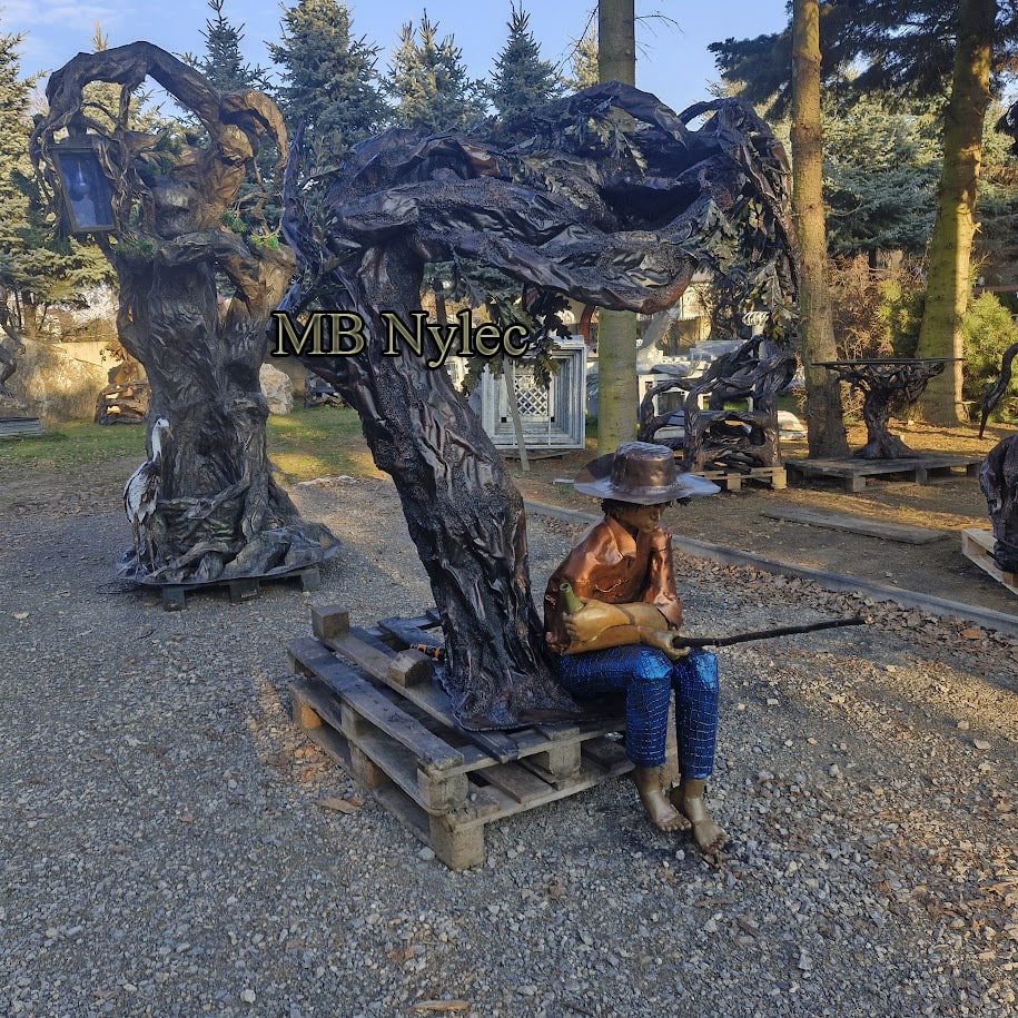 Steel tree and hunter figure on display at our forge