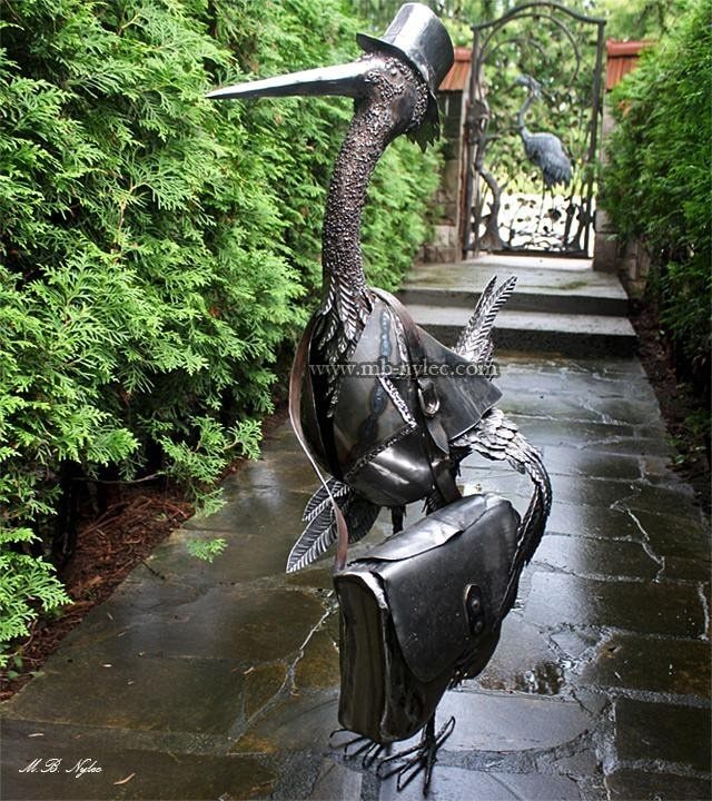 Stork postman letterbox Z9 standing on a wet stone path