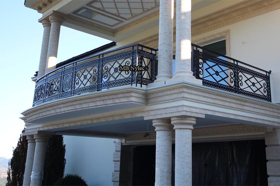 Versace-style wrought iron balcony railing BA45 with Greek key bands between white columns