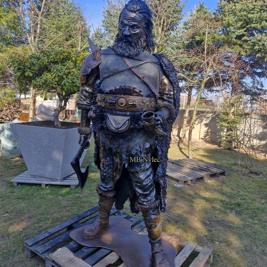 Viking made of steel with brass shoulder plates and a studded belt