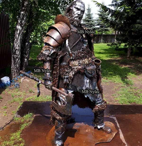 Viking Z84 with layered armour and shield on a garden lawn