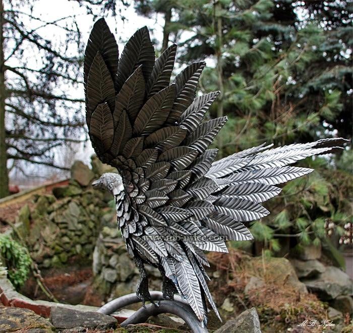 Steel wild duck Z6 with wings raised as it takes off