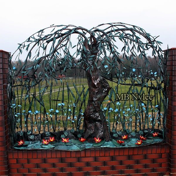 Willow and water lily fence span BM43 on a brick wall against a field